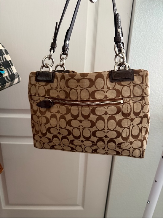 Coach Signature Canvas Shoulder Bag in Brown. Matching Coach wallet main image 8